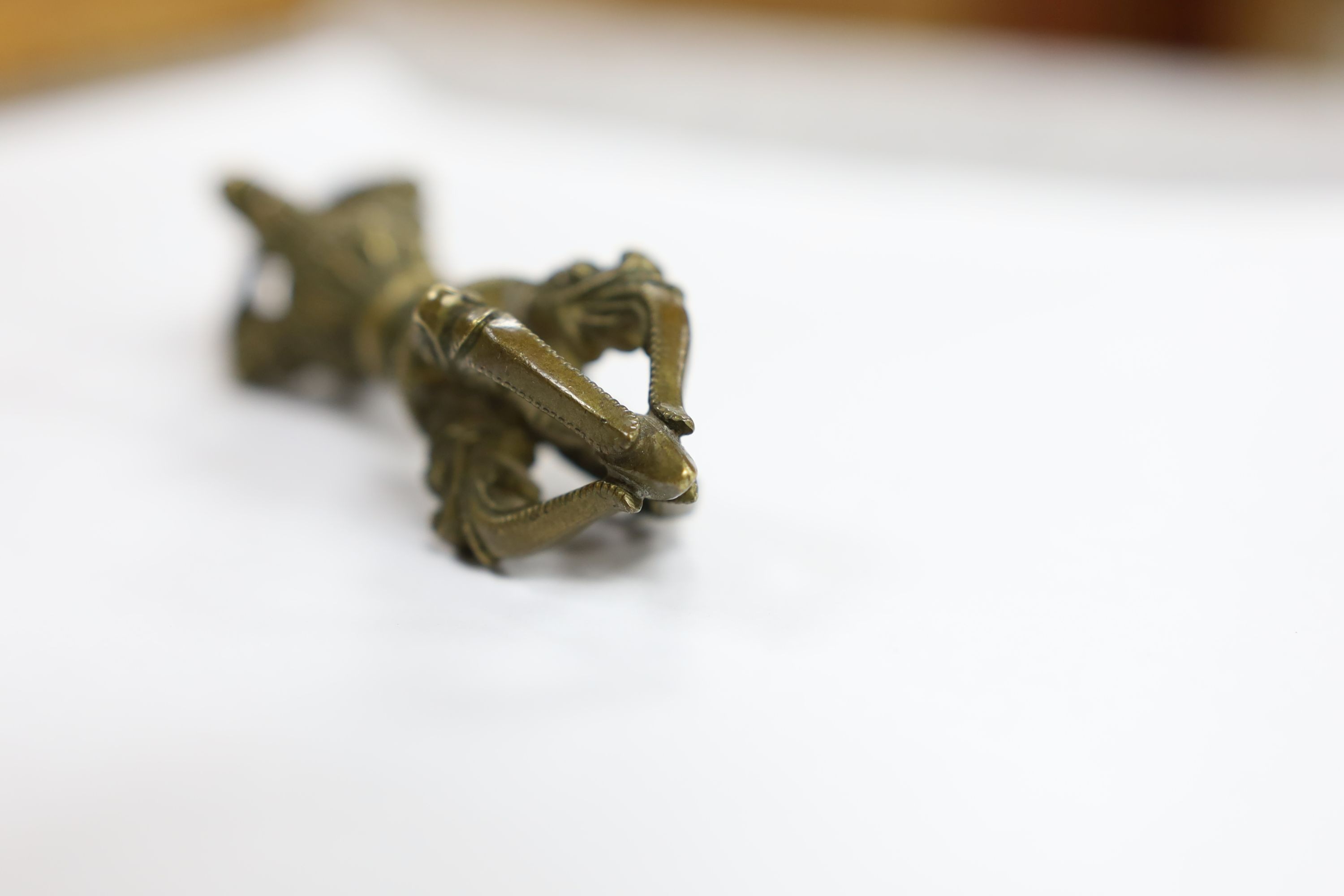 Five Chinese or Tibetan bronze figures or Buddhist implements, tallest 13cms high